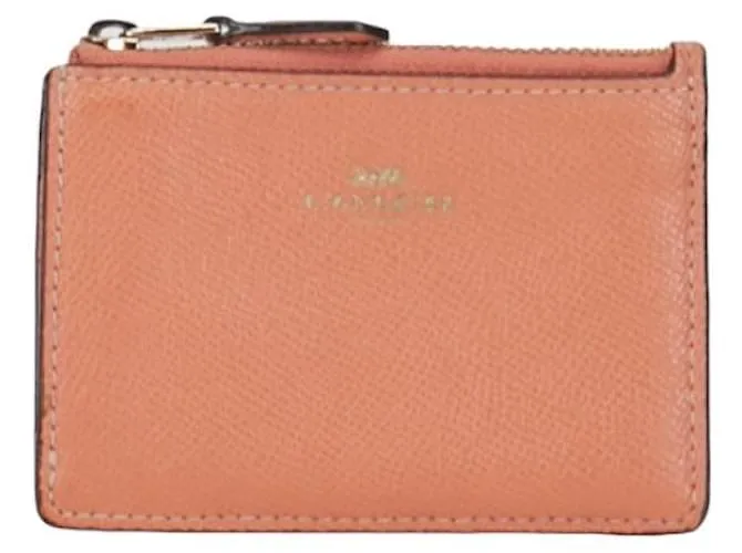 Monedero de cuero Coach rosa en muy buen estado 