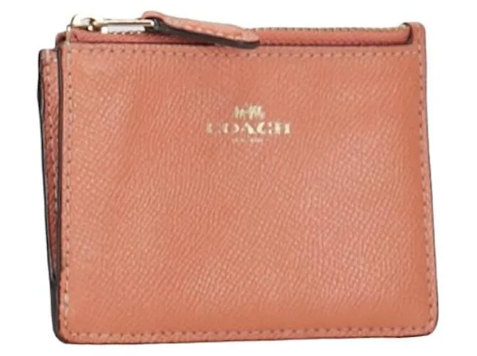 Monedero de cuero Coach rosa en muy buen estado 